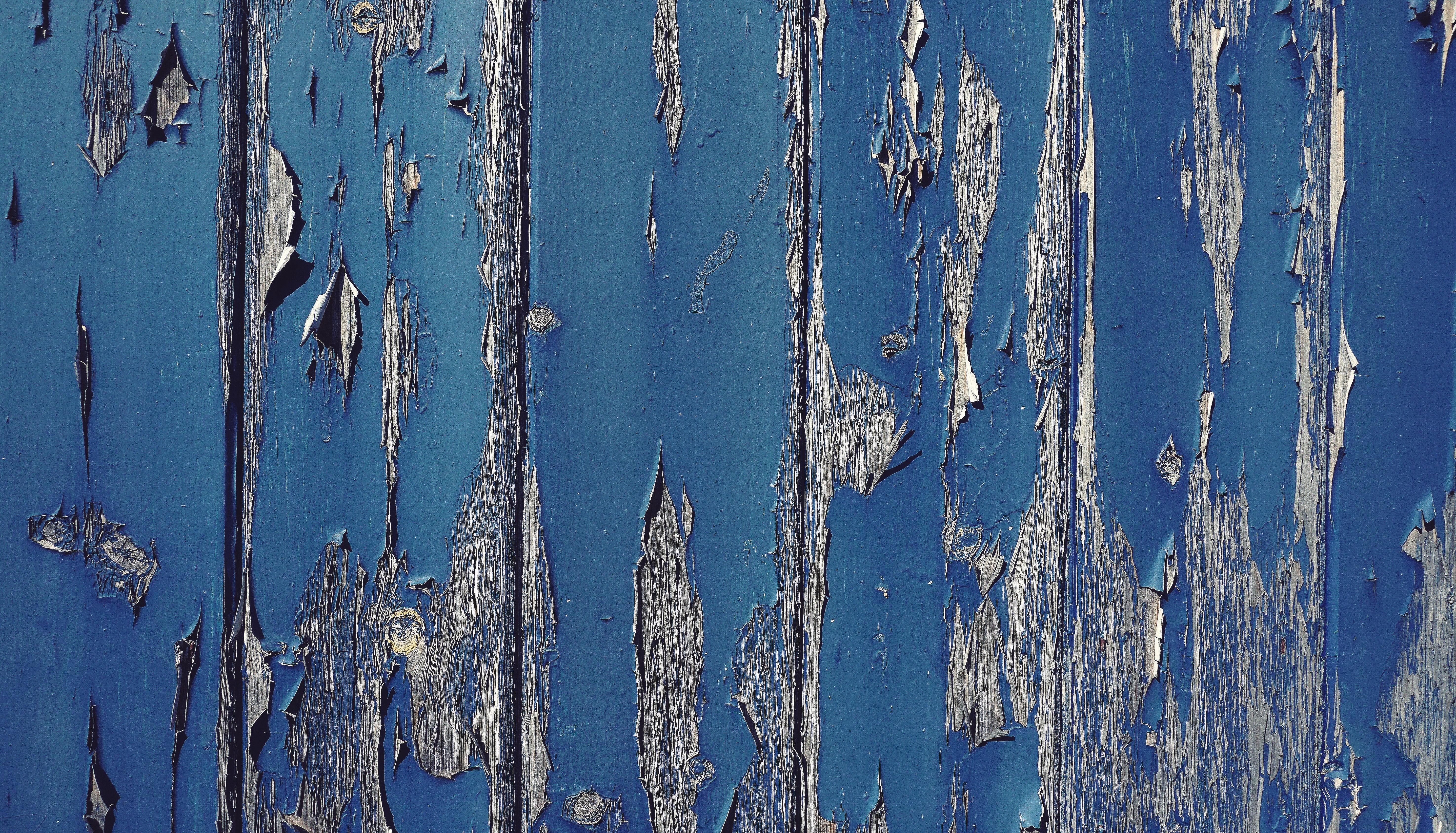 Gray wood with cracked blue paint